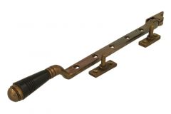 Entrebâilleur de fenêtre laiton patiné bakélite (1908)