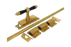 Crémone en applique pour fenêtre laiton poli (1890)