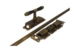 Crémone en applique pour fenêtre laiton patiné (1895)