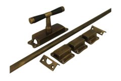 Crémone en applique pour fenêtre laiton patiné (1918)